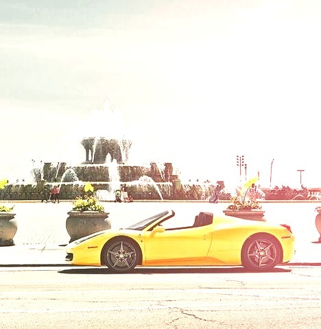 Yellow Ferrari Parked Infront of Fountains